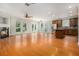 Expansive living room with fireplace, hardwood floors, and seamless transition to the gourmet kitchen at 5575 Julian Pl, Atlanta, GA 30342
