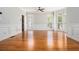 Bright living room with hardwood floors, large windows, and elegant wainscoting at 5575 Julian Pl, Atlanta, GA 30342