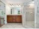 Stylish main bathroom boasts double vanity, glass shower, and modern fixtures at 5575 Julian Pl, Atlanta, GA 30342