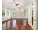 Spacious main bedroom features trey ceiling, ceiling fan, large windows, and an ensuite bathroom at 5575 Julian Pl, Atlanta, GA 30342
