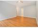 Large main bedroom with hardwood floors, a ceiling fan, and an ensuite bathroom at 5575 Julian Pl, Atlanta, GA 30342