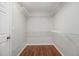 Spacious walk-in closet boasts hardwood floors and ample shelving for storage at 5575 Julian Pl, Atlanta, GA 30342