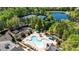 Aerial view of pool, tennis courts, gardens and pond offering luxury amenities for residents at 507 Bonneset Ct, Canton, GA 30114