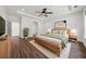 Bright bedroom features hardwood floors, a ceiling fan, and neutral decor at 507 Bonneset Ct, Canton, GA 30114