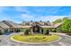 Stately clubhouse with beautiful landscaping and circular drive shows refined community living at 507 Bonneset Ct, Canton, GA 30114