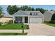 Charming single-Gathering home featuring a well-manicured lawn, a two-car garage, and welcoming front porch at 507 Bonneset Ct, Canton, GA 30114