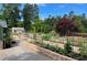 Beautiful community gardens with raised beds and a gravel path, perfect for gardening enthusiasts at 507 Bonneset Ct, Canton, GA 30114