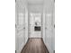 Hallway leads to a bright bathroom with double vanity at 507 Bonneset Ct, Canton, GA 30114
