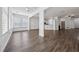 Spacious open-concept living space with hardwood floors, white trim, and abundant natural light at 507 Bonneset Ct, Canton, GA 30114