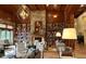 Cozy lounge with bookshelves, fireplace, and comfortable seating, ideal for relaxing and reading at 507 Bonneset Ct, Canton, GA 30114
