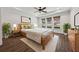 Serene main bedroom with tray ceilings, natural light, and wood floors; a relaxing retreat at 507 Bonneset Ct, Canton, GA 30114