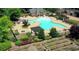 Inviting pool area with lounge chairs and garden plots offering a perfect blend of recreation and nature at 507 Bonneset Ct, Canton, GA 30114