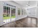 Sun-drenched sun room featuring a sliding glass door to the backyard and abundant natural light at 507 Bonneset Ct, Canton, GA 30114