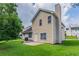 Two-story home with vinyl siding and a spacious green backyard at 6207 Idlewood Cir, Lithonia, GA 30038