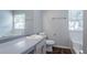 Bathroom featuring a bath tub and a wood-look vanity sink at 6207 Idlewood Cir, Lithonia, GA 30038