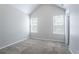 Bedroom features plush carpet, vaulted ceiling, neutral paint and two bright windows at 6207 Idlewood Cir, Lithonia, GA 30038