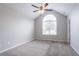 Bright bedroom with vaulted ceiling features plush carpet and a large window at 6207 Idlewood Cir, Lithonia, GA 30038