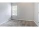 Cozy bedroom features plush carpet, neutral paint, and a bright window at 6207 Idlewood Cir, Lithonia, GA 30038