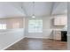 Cozy dining area with black appliances, overhead lighting, and an adjacent window at 6207 Idlewood Cir, Lithonia, GA 30038