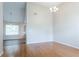 Bright dining room with a vaulted ceiling, modern chandelier, and hardwood flooring at 6207 Idlewood Cir, Lithonia, GA 30038