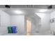 An inside view of the garage, featuring a back door and open ceiling at 6207 Idlewood Cir, Lithonia, GA 30038