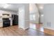 Charming kitchen featuring black appliances, light wood cabinets, and granite-look countertops at 6207 Idlewood Cir, Lithonia, GA 30038