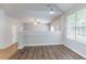 Bright living room featuring vaulted ceilings, abundant natural light and ceiling fan at 6207 Idlewood Cir, Lithonia, GA 30038