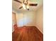 Bedroom with hardwood floors, ceiling fan and double closet at 1098 Laurel Nw Ln, Conyers, GA 30012