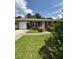 Charming single-story brick home with an inviting front yard and an attached garage at 1098 Laurel Nw Ln, Conyers, GA 30012