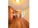 Classic kitchen featuring wood cabinets, laminate floor, and white appliances at 1098 Laurel Nw Ln, Conyers, GA 30012
