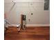 An unfinished laundry room with painted walls, wood-look floors, and a white wire rack at 1098 Laurel Nw Ln, Conyers, GA 30012