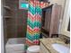 Bathroom featuring neutral tile, vanity with granite counters, and shower with a colorful curtain at 1280 Sanden Ferry Dr, Decatur, GA 30033