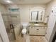 Bathroom features a tiled shower, vanity with granite counters, and a framed mirror at 1280 Sanden Ferry Dr, Decatur, GA 30033