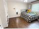 Bedroom with a bed, hardwood floors, and ample natural light at 1280 Sanden Ferry Dr, Decatur, GA 30033
