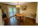 Dining area with a round wooden table, four chairs and a sliding door to a deck at 1280 Sanden Ferry Dr, Decatur, GA 30033