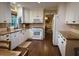 Bright kitchen featuring white cabinets, granite countertops, and stainless steel appliances at 1280 Sanden Ferry Dr, Decatur, GA 30033