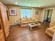 Cozy living room featuring hardwood floors and a large window for natural light at 1280 Sanden Ferry Dr, Decatur, GA 30033