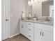 Bright bathroom features double sink vanity with granite countertops and modern lighting at 1420 Fieldgreen Overlook, Stone Mountain, GA 30088