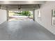 Garage with finished gray floor and view to the street at 1420 Fieldgreen Overlook, Stone Mountain, GA 30088