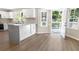 Bright kitchen with granite countertops and access to deck at 1420 Fieldgreen Overlook, Stone Mountain, GA 30088