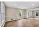 Bright living room with hardwood floors, neutral paint, white trim and abundant natural light at 1420 Fieldgreen Overlook, Stone Mountain, GA 30088