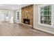Inviting living room showcases stone fireplace and great natural light at 1420 Fieldgreen Overlook, Stone Mountain, GA 30088