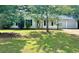 Charming single-story home with attached two-car garage, covered front porch, and a well-maintained lawn at 298 Thorn Thicket Dr, Rockmart, GA 30153