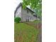 View of the backyard from the side of the home with a privacy fence at 1675 Bouldercliff Se Ct, Atlanta, GA 30316