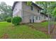 Side of house showing the backyard, privacy fence, and exterior AC unit at 1675 Bouldercliff Se Ct, Atlanta, GA 30316