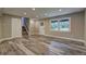 Finished basement with new flooring, recessed lighting and an entry door at 1675 Bouldercliff Se Ct, Atlanta, GA 30316