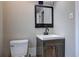 Half bath featuring a modern vanity with a dark wood cabinet at 1675 Bouldercliff Se Ct, Atlanta, GA 30316