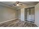 Bedroom featuring wood-look floors and a closet with built-in shelving at 1675 Bouldercliff Se Ct, Atlanta, GA 30316