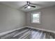 Cozy bedroom with wood-look flooring, a ceiling fan and a window at 1675 Bouldercliff Se Ct, Atlanta, GA 30316