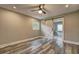 Bedroom with hardwood floors, barn door to bathroom and ceiling fan at 1675 Bouldercliff Se Ct, Atlanta, GA 30316